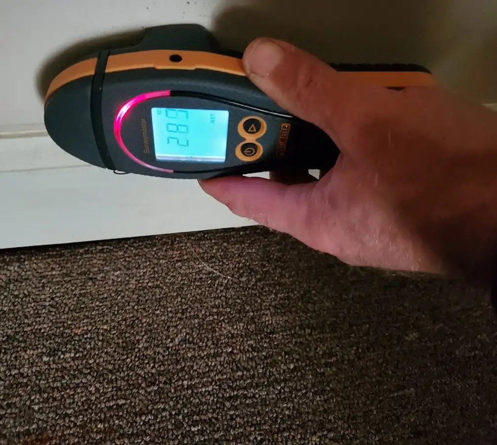 Moisture detection at baseboard during Storm Damage Restoration in West Modesto
